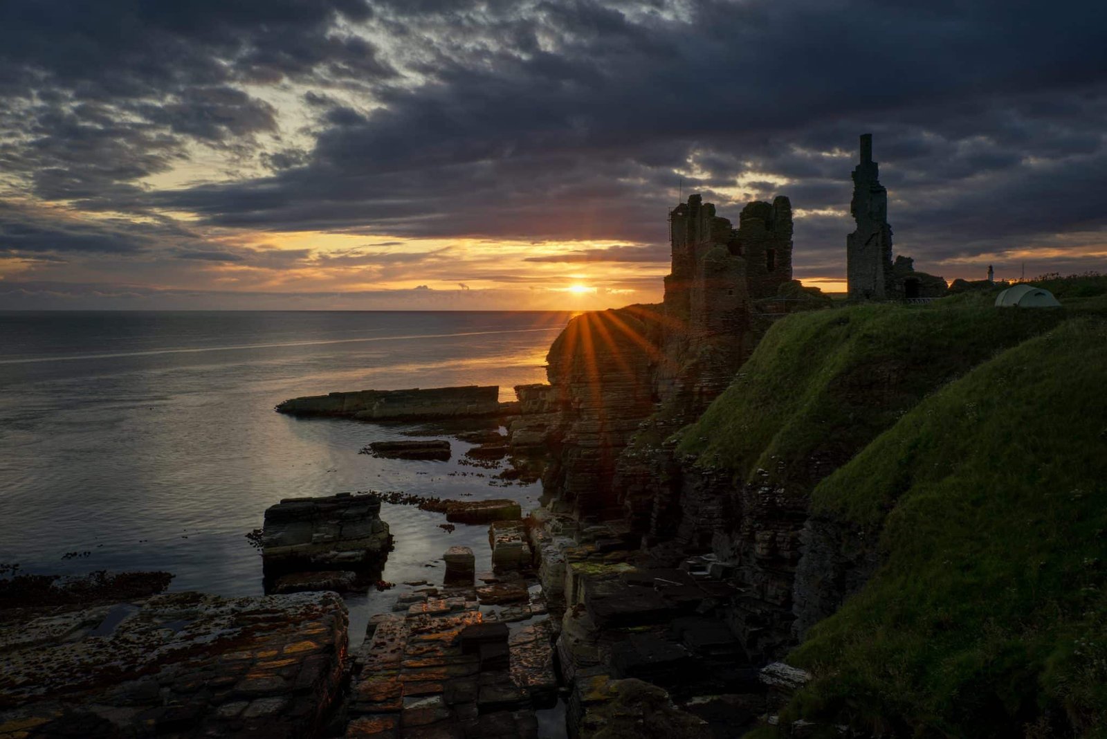 Castle Sinclair Girnigoe cliffs on east coast of Scotland in sunrise