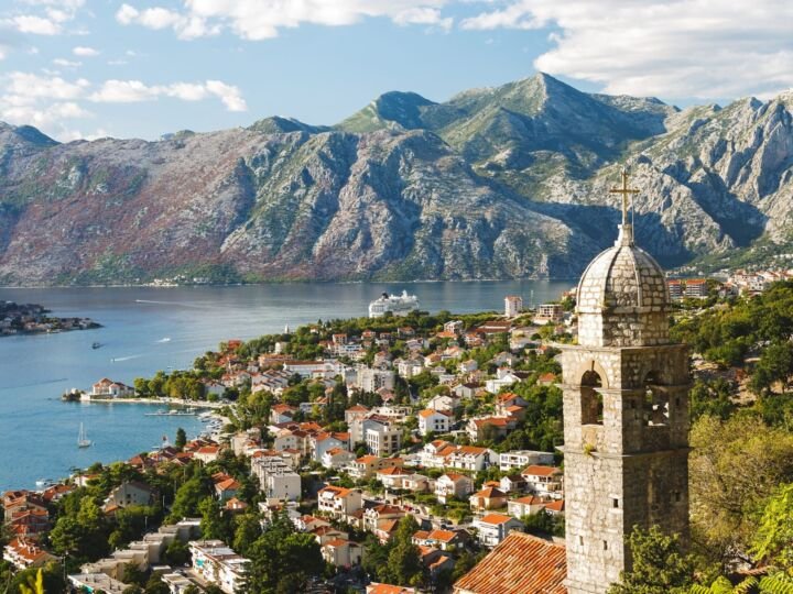 Aerial view with Kotor bay and old town rooftops. Church of Our Lady of Remedy in the Fortress of Kotor, Boka Kotorska, Montenegro.