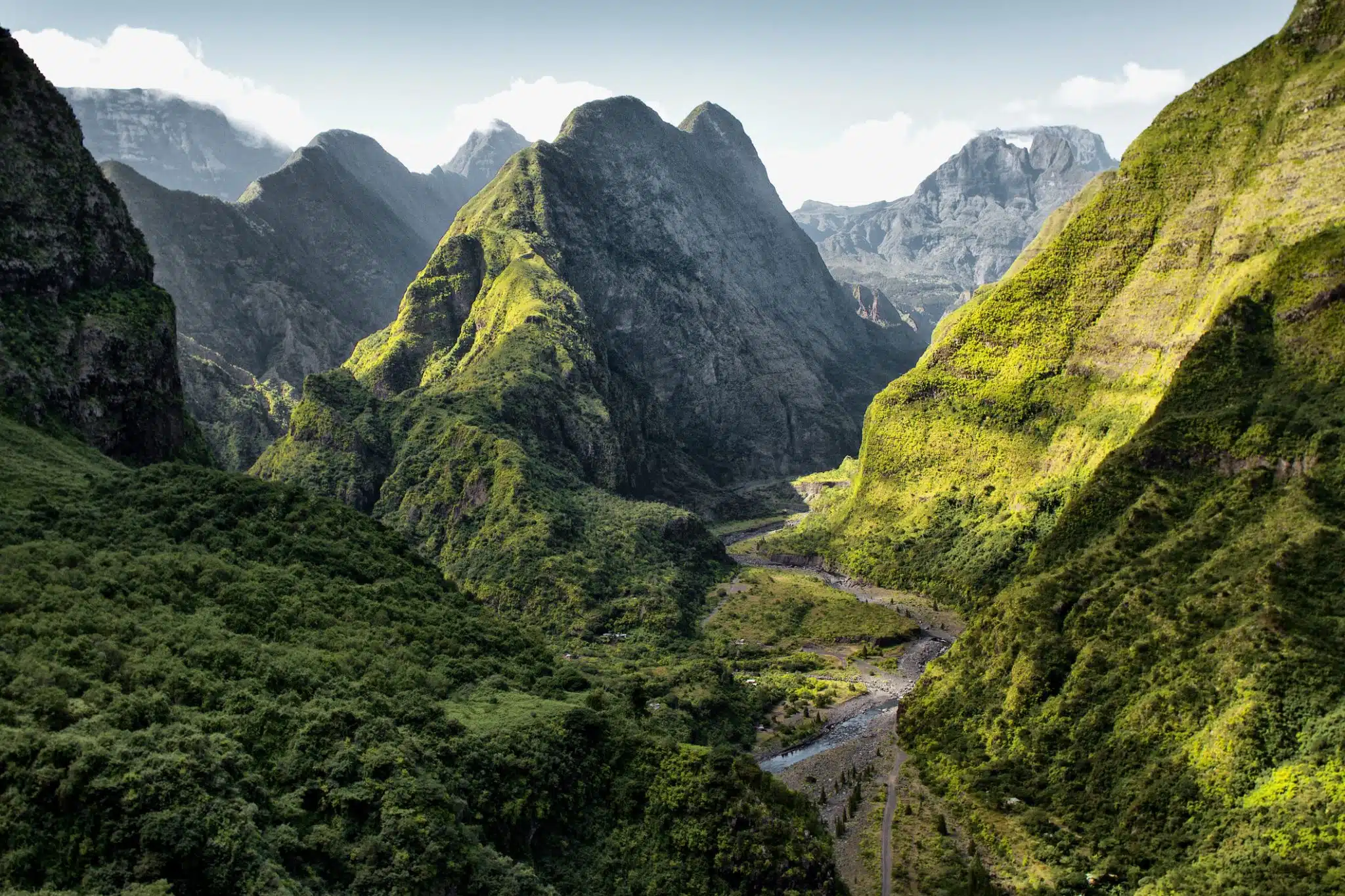 Beautiful Landscapre in Mafate Cirque, Reunion Island. A trail leads off between several huge pointed mountains.