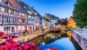 Colmar, Alsace, France. Petite Venice, water canal and traditional half timbered houses.