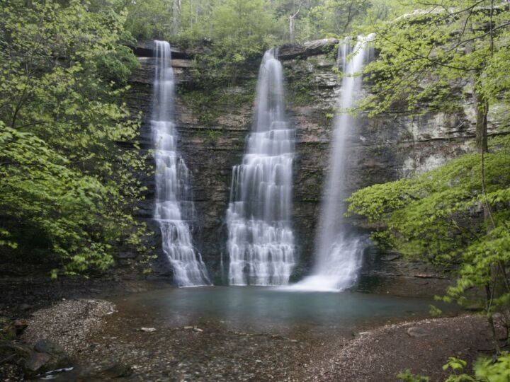 Ozark waterfall in Arkansas. Trees around, and natural swimming pool
