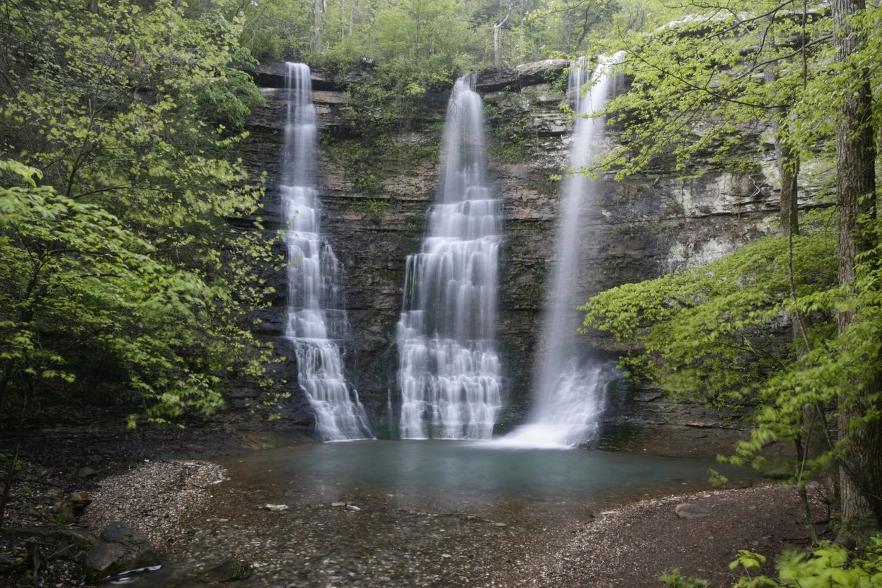 Ozark waterfall in Arkansas. Trees around, and natural swimming pool