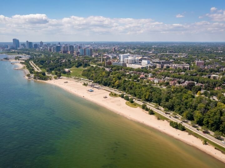Aerial view Lake Michigan coastline featuring Lake Park, Bradford Beach and downtown Milwaukee skyline.