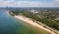 Aerial view Lake Michigan coastline featuring Lake Park, Bradford Beach and downtown Milwaukee skyline.