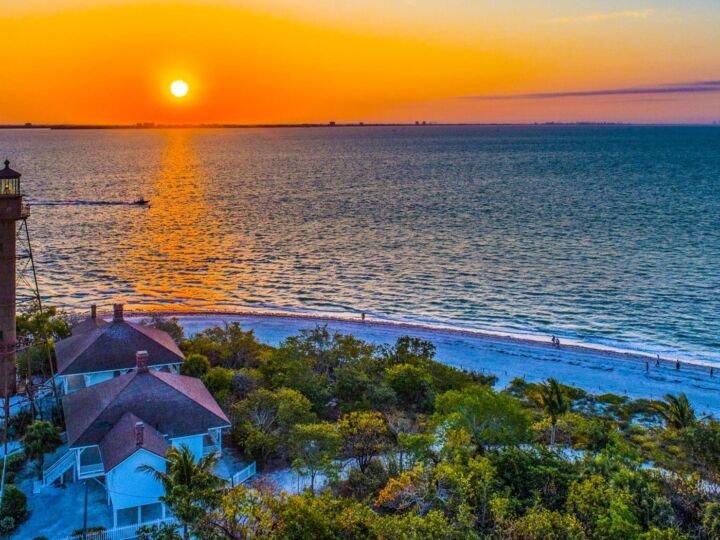 Sanibel Island Lighthouse Sunrise,Florida, sun rising over water in background
