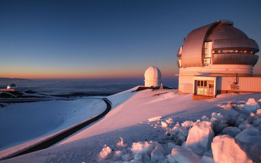 Snowy Mauna Kea Observatory at Sunset