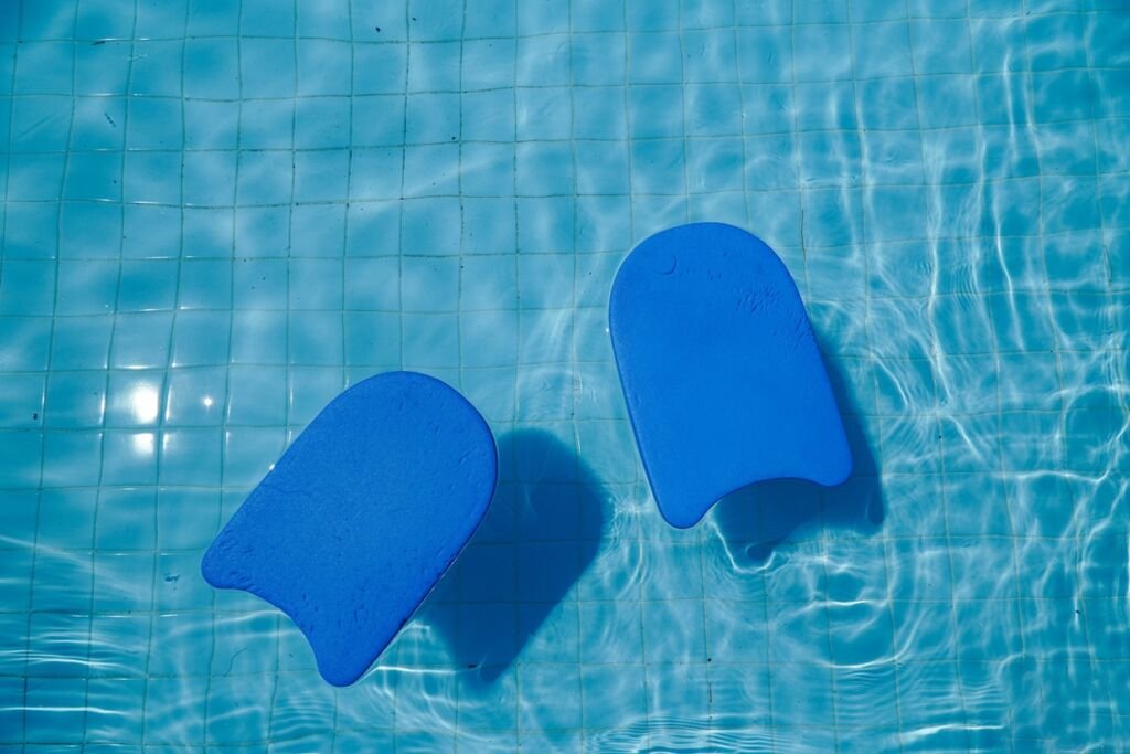 Blue foam board for teaching swimming by the pool