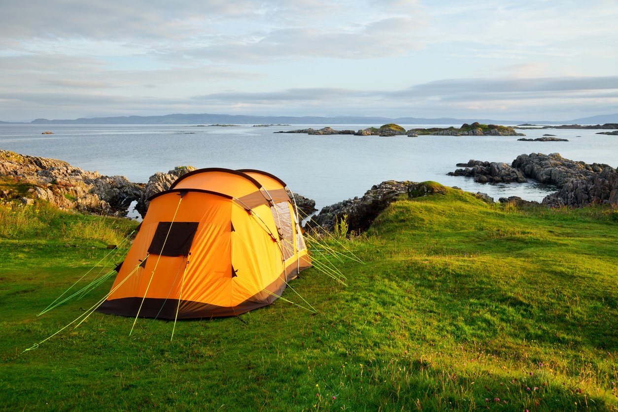 Camping tent on ocean shore