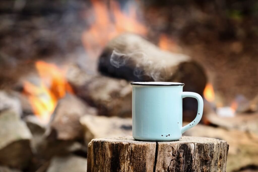 campfire with coffee beside it