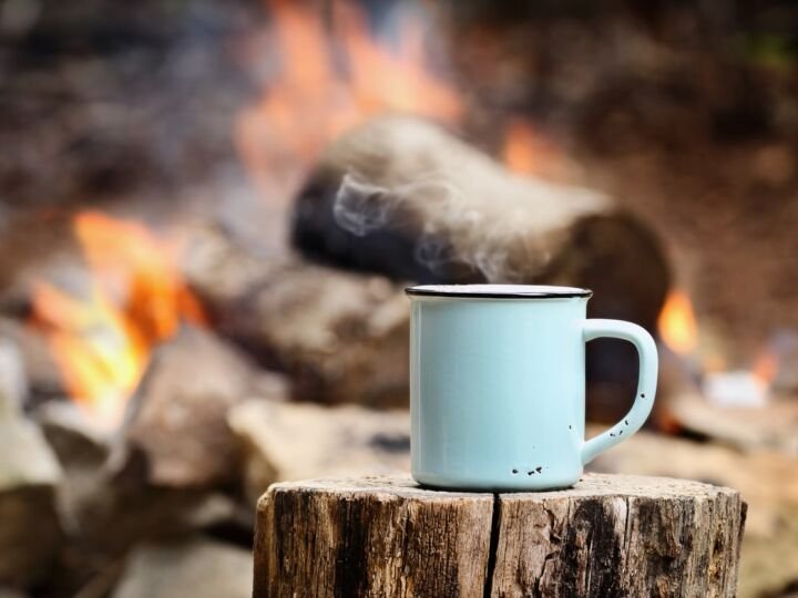 campfire with coffee beside it
