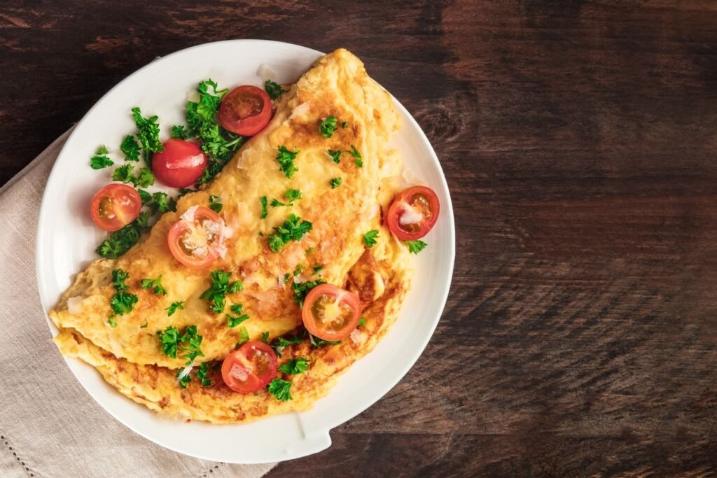 Omelet with parsley, cherry tomatoes