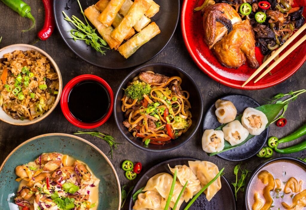 assortment of asian dishes on a table
