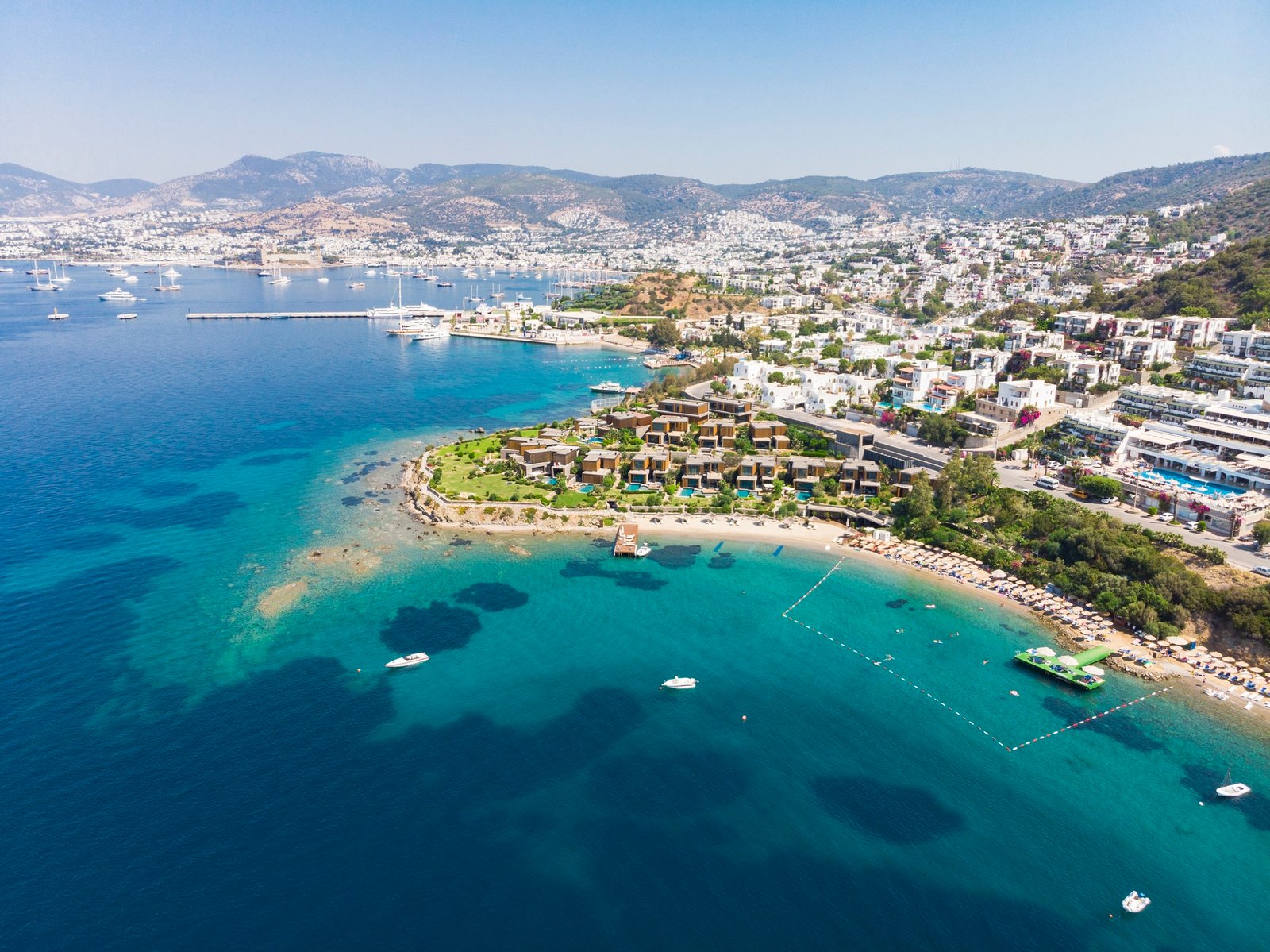Aerial view of sunny Bodrum with resorts and beachfront villas, Turkey