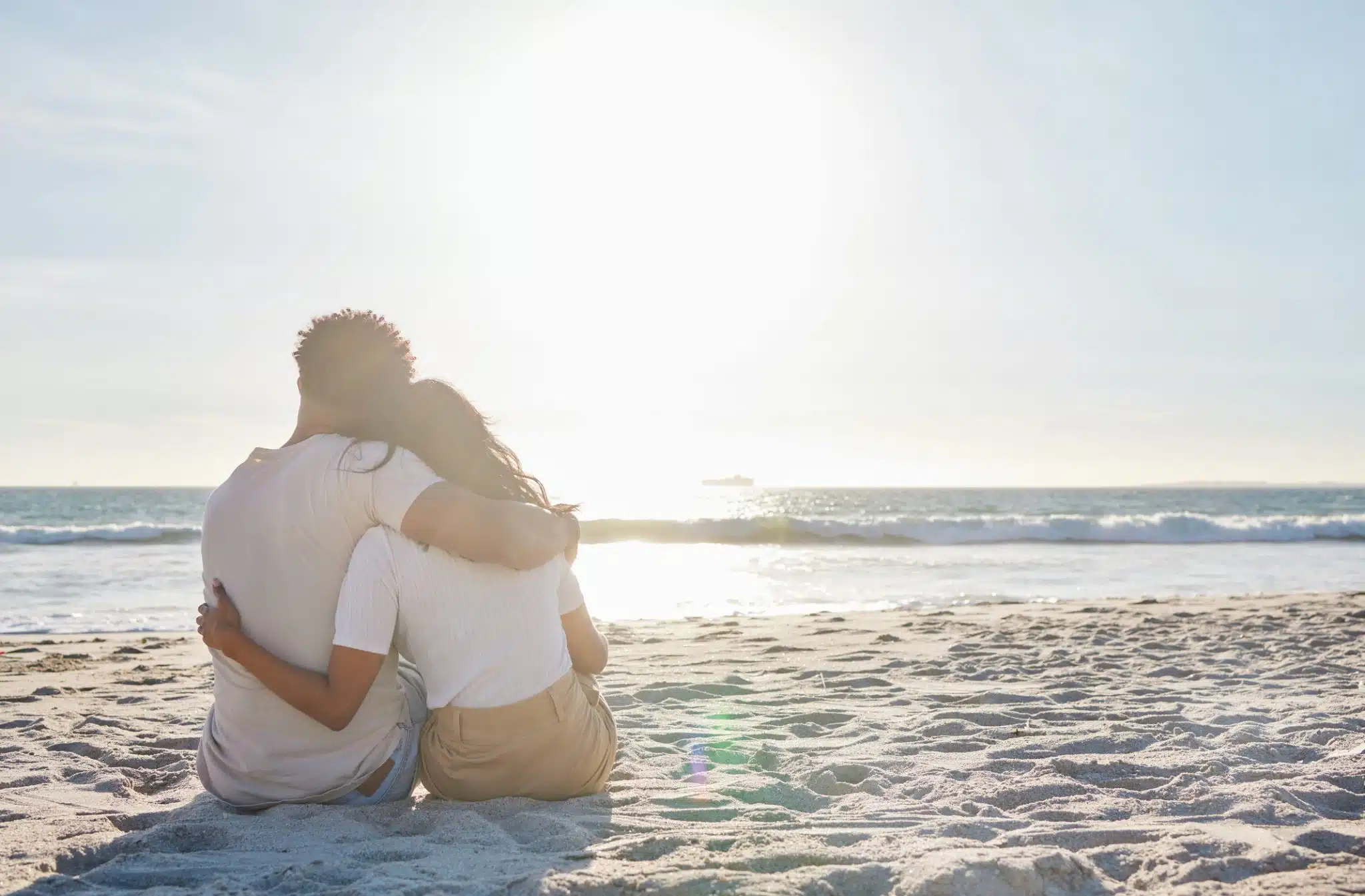 Full length shot of an affectionate young couple sharing an intimate moment at the beach