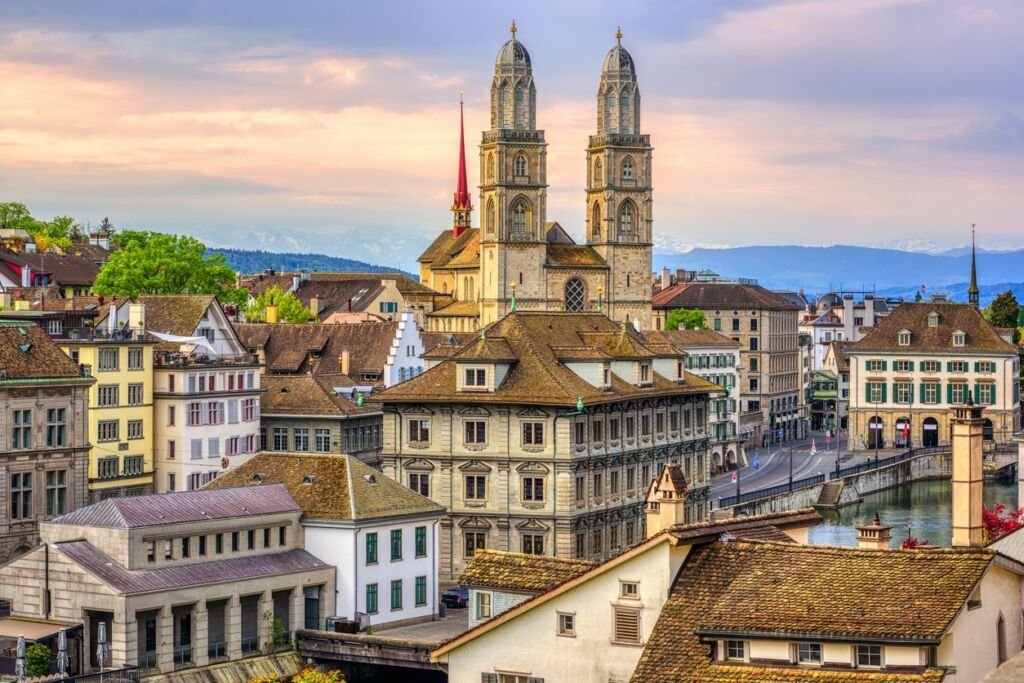 Zurich city center, view over Old town roofs to Grossmunster cathedral, Switzerland
