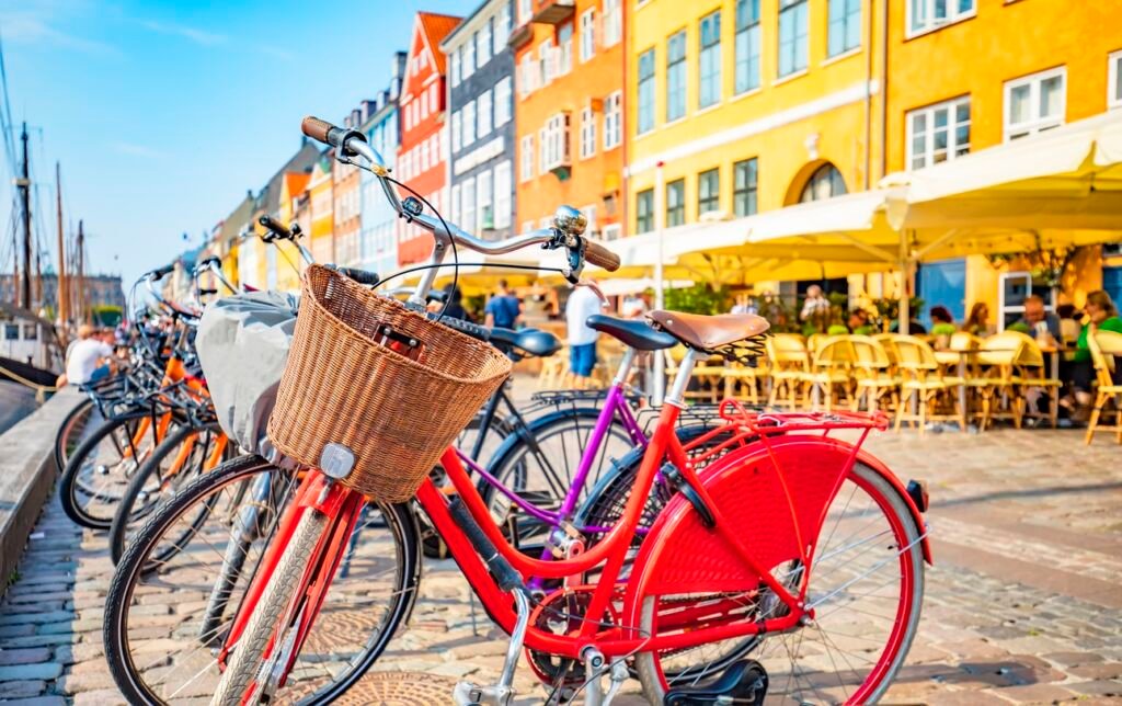 Scenic view of Copenhagen old town, Nyhavn harbor, selective focus on a front bicycle