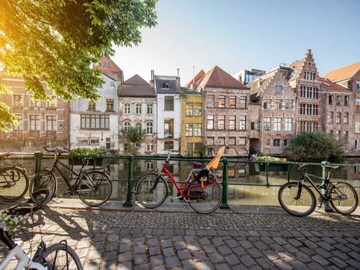 Riverside view with beautiful old buildings and bicycles during the morning light in Gent city, Belgium
