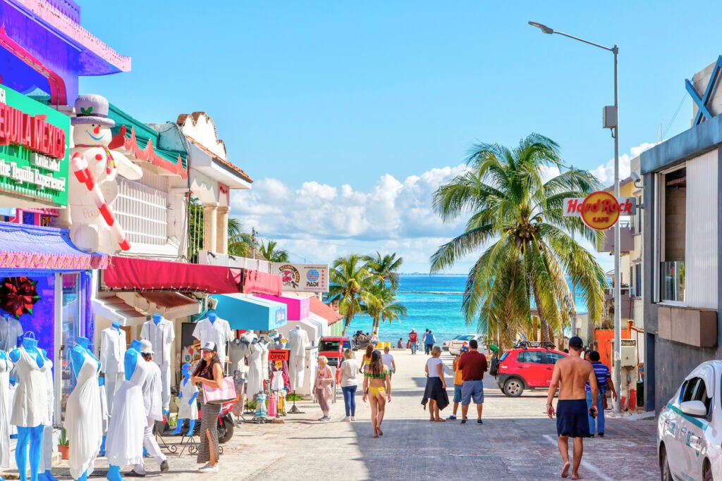 Playa del Carmen thrives with vibrant energy as visitors indulge in shopping along the famous beachside entertainment district. The Yucatan's Caribbean charm captivates, creating a lively haven in Cancun.