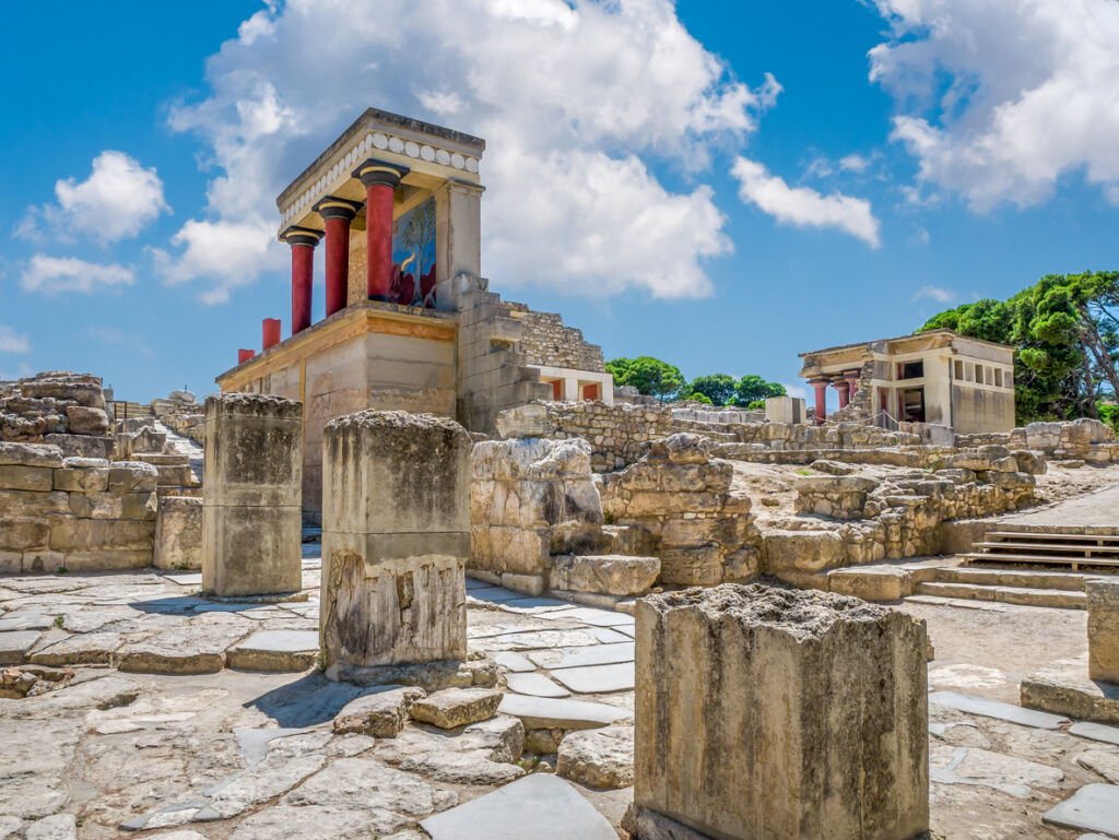 Ancient mystique lingers in the Knossos palace ruins, Crete's treasure. Minoan grandeur, once a thriving civilization, whispers through the timeworn stones, a captivating journey through history.