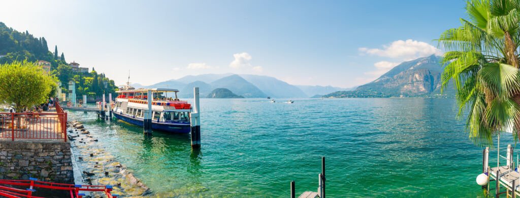 Varenna's charm unfolds by Lake Como—a quaint Italian village. A ferry glides across the serene waters, echoing the timeless allure of this European gem nestled in the heart of Italy.