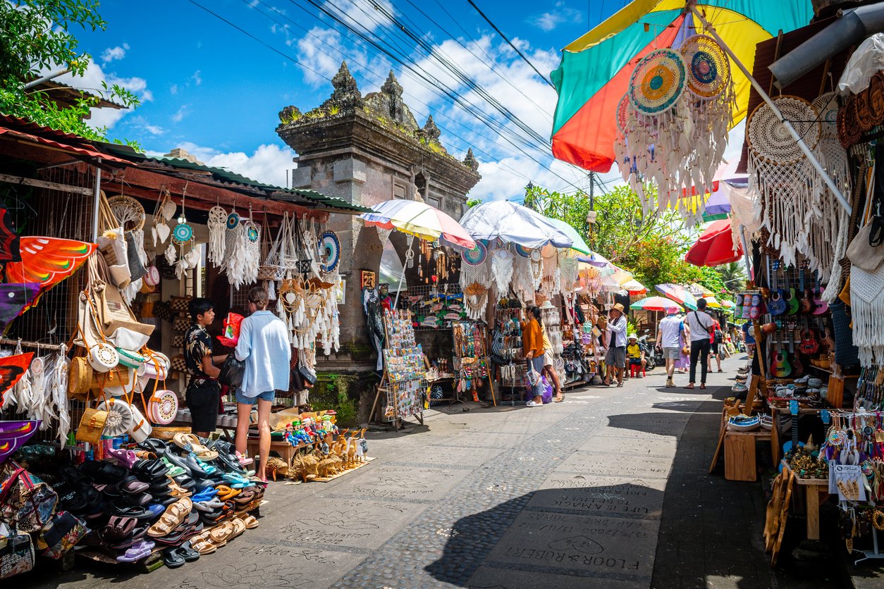 In Ubud, Indonesia, the market street bustles with vibrant energy—colorful stalls, aromatic spices, artisan crafts—creating a sensory tapestry within this cultural heart of Bali.