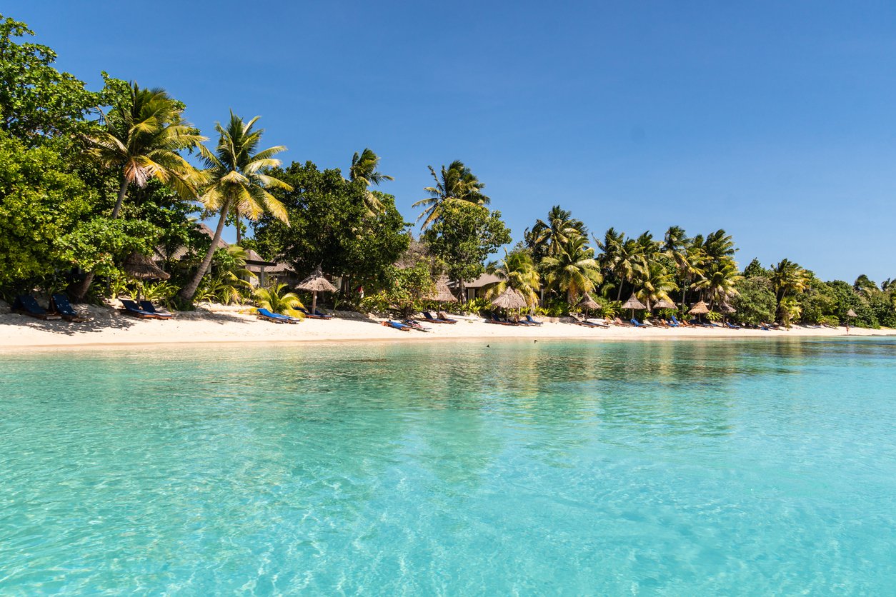 A pristine, turquoise expanse of the South Pacific, framed by the Yasawa Islands in Fiji, beckons with its idyllic, exotic allure, an enchanting paradise of sun-kissed shores.