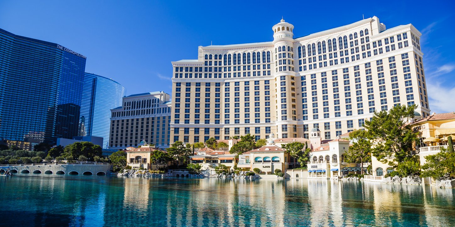 Las Vegas Strip, a summer's day: The Bellagio and Cosmopolitan resorts stand as epitomes of luxury. Amid the desert heat, these iconic hotels and casinos define Vegas opulence.