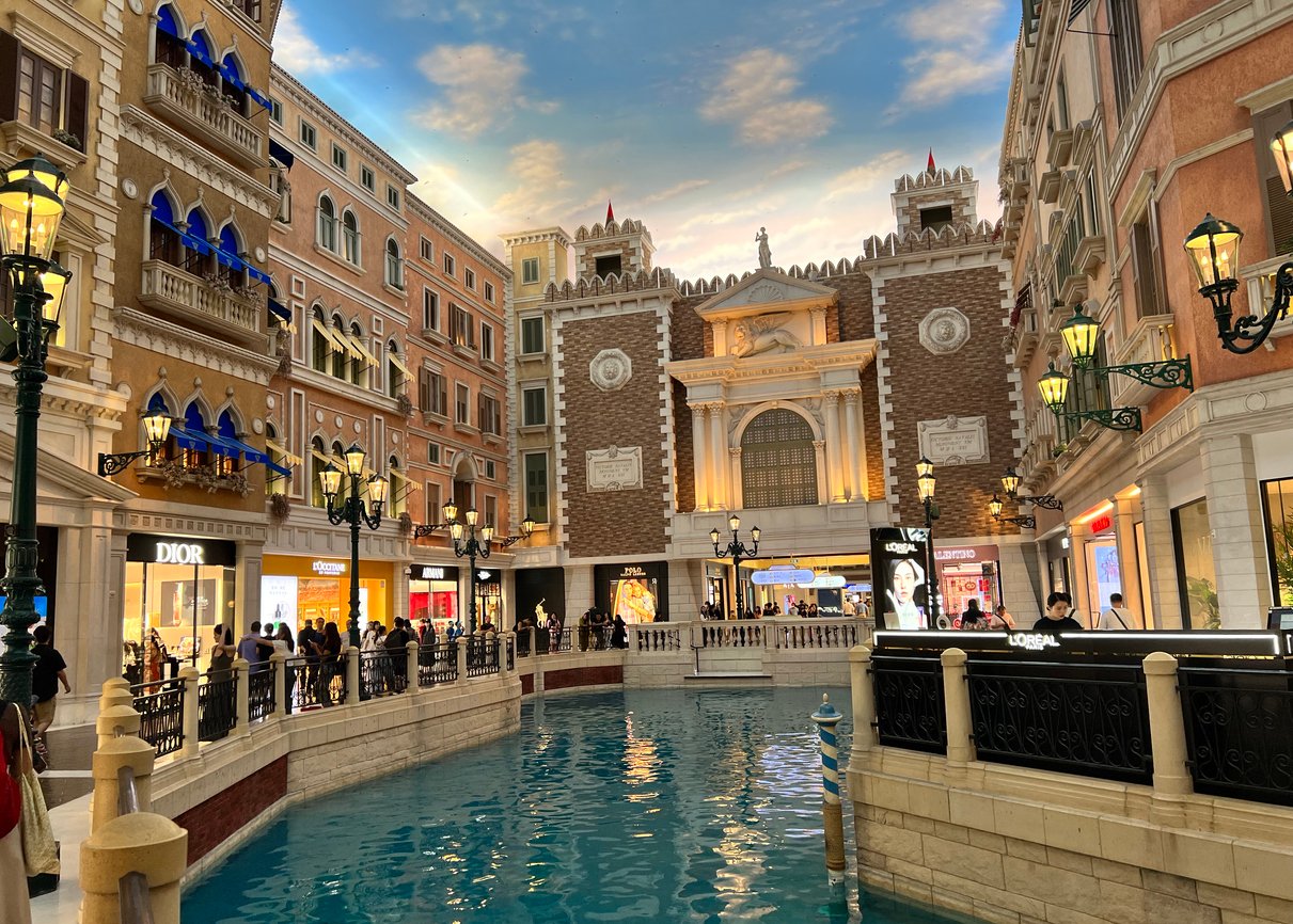 July 2, 2023: Navigating the enchanting canals of The Venetian Macao in Macau, China. This famous hotel and casino recreate the allure of Venice with architectural splendor and romantic waterways.