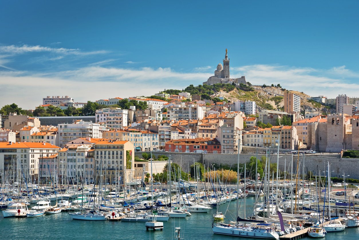 Marseille's Old Port exudes maritime charm. Quaint fishing boats bob gently amid historic buildings, their sun-kissed facades reflecting in the sparkling Mediterranean waters, whispering tales of centuries past.