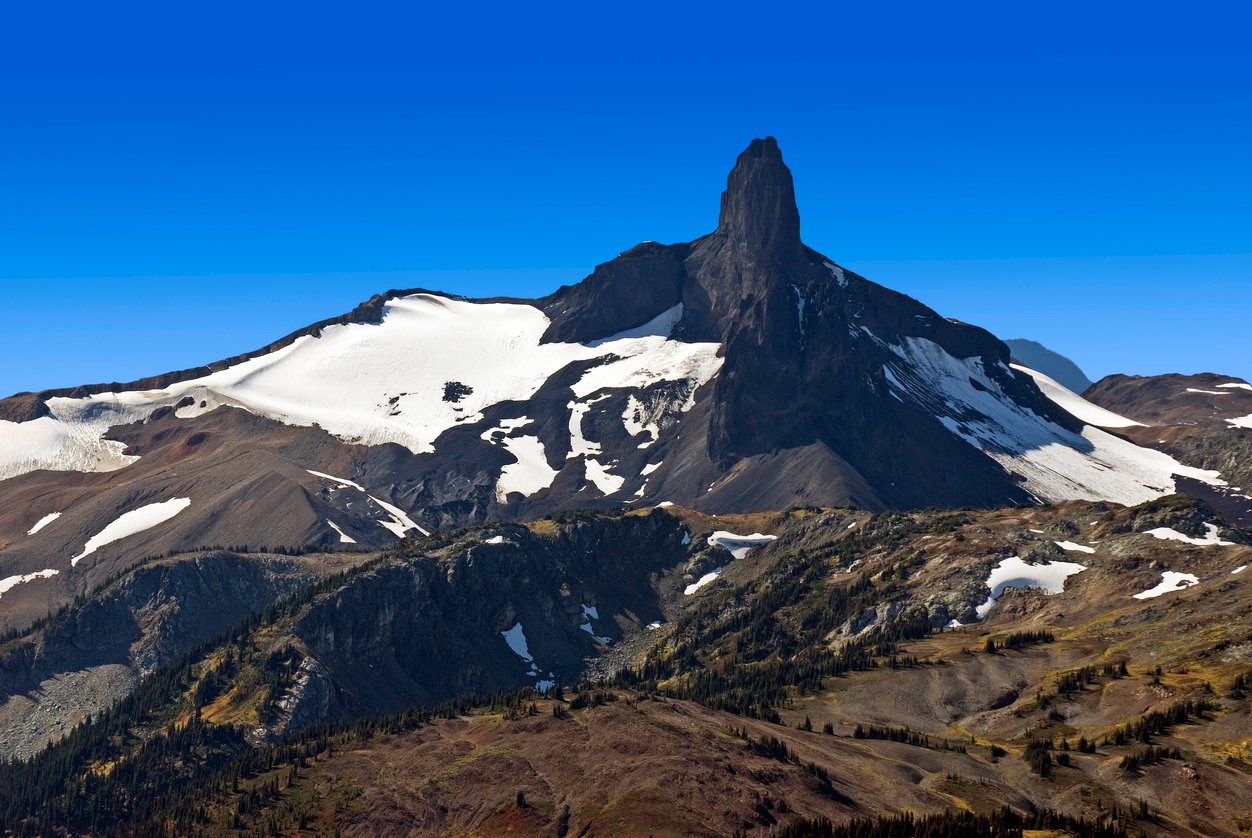 Rising dramatically in the Coast Mountain range, Black Tusk Peak commands attention with its jagged silhouette. A volcanic spire, nature's sculpture, standing resolute against the alpine backdrop.