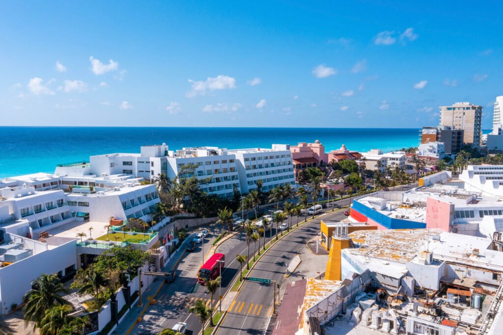 Punta Norte Beach, Cancun, Mexico: A breathtaking aerial perspective unveils a stunning coastal panorama. Luxury hotels adorn the pristine beach, creating an idyllic retreat along the turquoise waters of the Caribbean Sea.