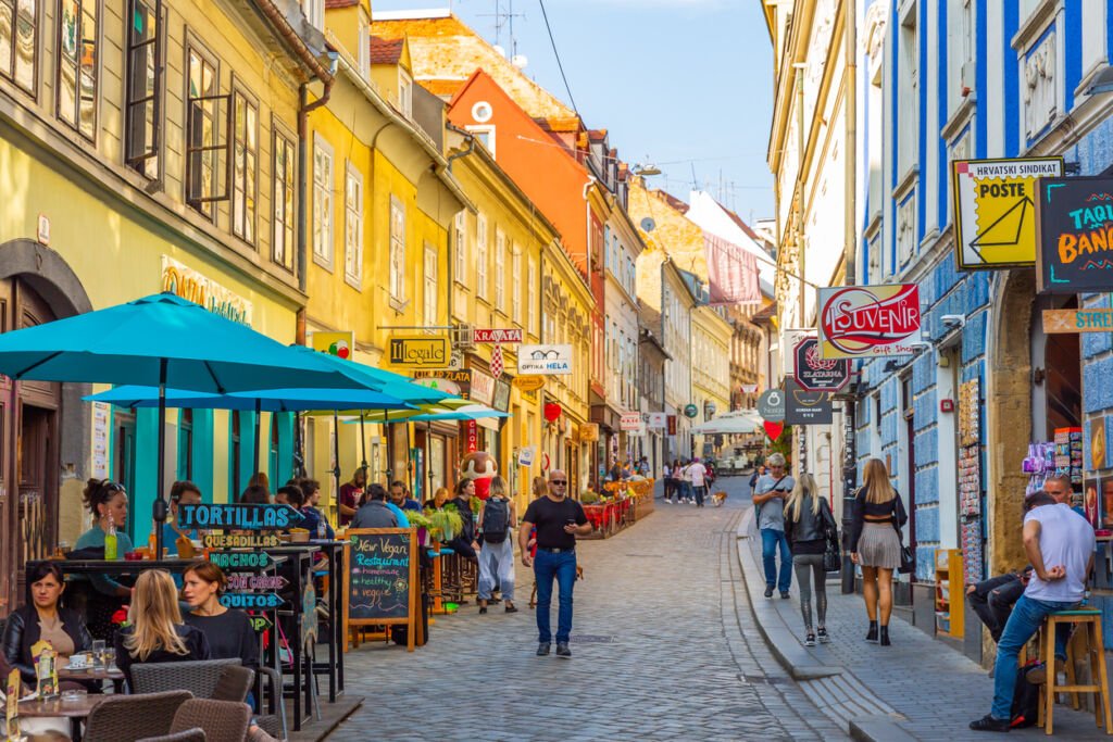 Capturing Zagreb's coffee culture, this image features a street cafe where locals gather for a delightful cup. The convivial atmosphere reflects Zagreb's charm as a city that embraces the art of coffee enjoyment.