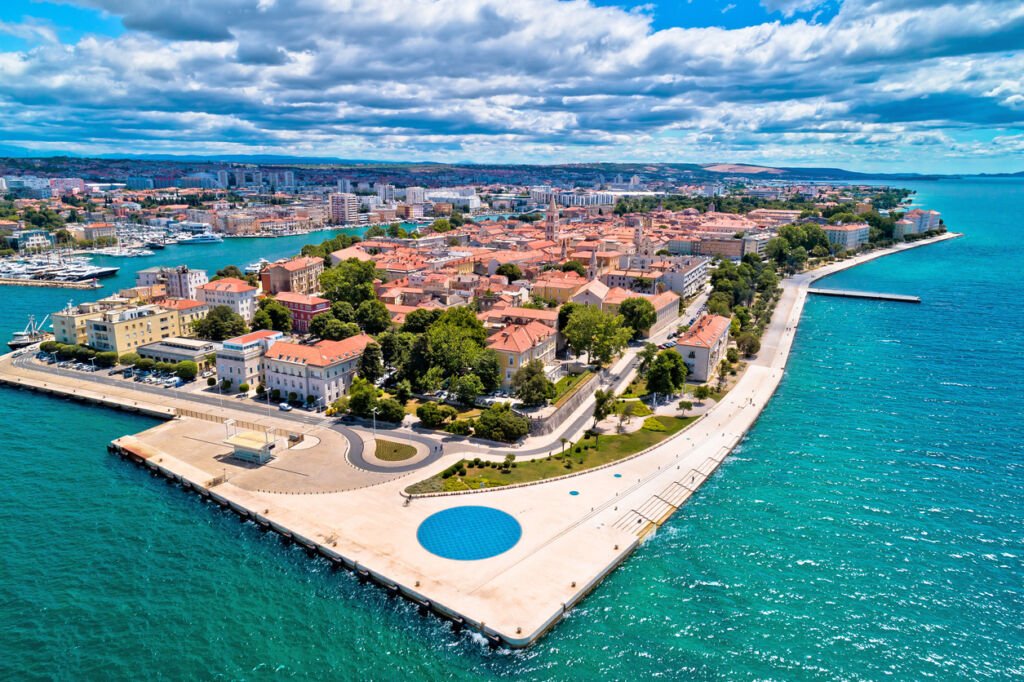 Zadar's historic peninsula unfolds in a panoramic aerial dance, revealing the timeless beauty of Dalmatia in Croatia. A tapestry of ancient charm, where history meets the Adriatic's azure embrace.