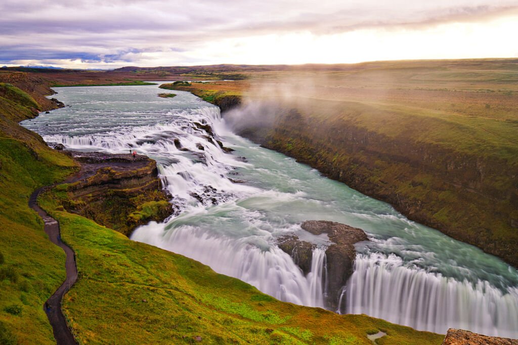 Gullfoss Waterfall in Iceland, a majestic spectacle, showcases diverse moods as its immense power and grandeur create ever-changing scenes. From thunderous cascades to serene beauty, nature's drama unfolds at this breathtaking destination.