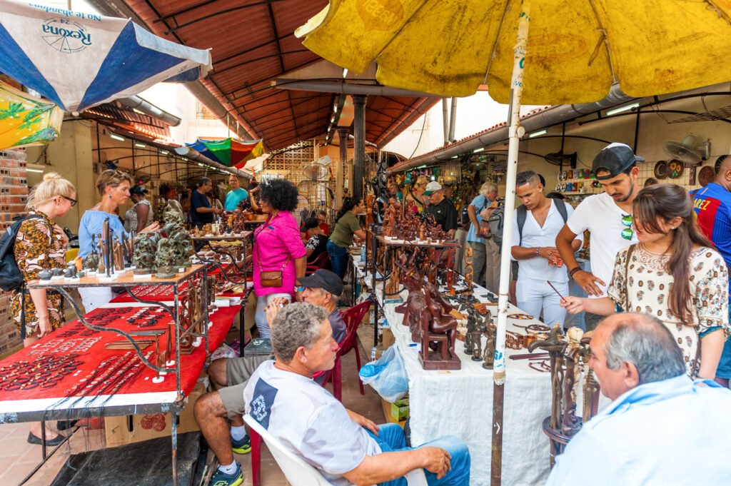 In Havana, Cuba, the enchanting Old Town beckons with its colorful streets and historic charm, while the bustling souvenir market offers a vibrant tapestry of Cuban culture and craftsmanship.
