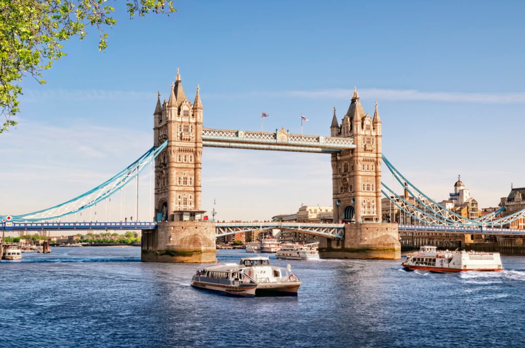 Tower Bridge in London stands majestic over the River Thames, its iconic twin towers and intricate Victorian architecture epitomizing the city's rich history and grandeur.
